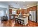 Open kitchen with granite countertops, stainless appliances, and a breakfast bar with seating for casual dining at 10152 Inverness Main St, Englewood, CO 80112