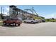 Parking lot with street side public transportation station in background at 10152 Inverness Main St, Englewood, CO 80112