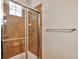 Tiled shower with glass door at 10152 Inverness Main St, Englewood, CO 80112