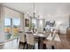 Modern dining room with a large table and open floor plan at 43074 Merion Hills Ct, Elizabeth, CO 80107