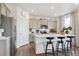 Modern kitchen featuring island with seating and stainless steel appliances at 43074 Merion Hills Ct, Elizabeth, CO 80107