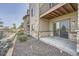 View of patio and back of building with sliding glass door at 3573 S Lisbon Ct, Aurora, CO 80013