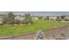 A large, well-maintained backyard with a privacy fence and view of the neighborhood at 3573 S Lisbon Ct, Aurora, CO 80013