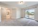 A spacious bedroom with a sliding glass door to the outside and ensuite bath at 3573 S Lisbon Ct, Aurora, CO 80013