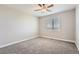 Bedroom with neutral carpet, a large window and neutral paint at 3573 S Lisbon Ct, Aurora, CO 80013