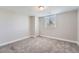 Bedroom has a window and neutral carpet at 3573 S Lisbon Ct, Aurora, CO 80013