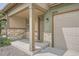 Inviting covered front porch with stone accents, a cozy entrance, and a convenient garage at 3573 S Lisbon Ct, Aurora, CO 80013