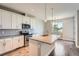 Contemporary kitchen features granite countertops, stainless steel appliances, and white cabinetry at 3573 S Lisbon Ct, Aurora, CO 80013