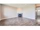 Open-concept living room features sleek gray wood floors and a modern corner fireplace at 3573 S Lisbon Ct, Aurora, CO 80013