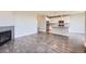 Open living space featuring a modern kitchen with gray floors connecting to the living room at 3573 S Lisbon Ct, Aurora, CO 80013