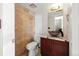 Tiled bathroom with granite countertop and modern sink basin at 2527 S Ouray Way, Aurora, CO 80013