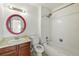 Bathroom with a bath and shower combination, with a large vanity at 2527 S Ouray Way, Aurora, CO 80013