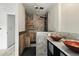 Bathroom featuring vessel sink, walk-in shower with stone tile and built-in niche at 2527 S Ouray Way, Aurora, CO 80013