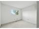 Empty bedroom with carpeted floors and large window with green view at 2527 S Ouray Way, Aurora, CO 80013