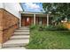 Charming home entrance showcasing a covered porch and inviting steps at 2527 S Ouray Way, Aurora, CO 80013