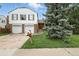 Charming two-story home featuring a two-car garage, brick accents, and mature landscaping at 2527 S Ouray Way, Aurora, CO 80013