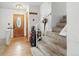 Inviting foyer with hardwood floors, staircase, and ample storage at 2527 S Ouray Way, Aurora, CO 80013