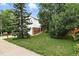 Charming home showcasing mature trees and a well-maintained lawn at 2527 S Ouray Way, Aurora, CO 80013