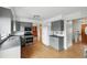 Bright kitchen features wood floors, gray cabinets, stainless steel oven and range at 2527 S Ouray Way, Aurora, CO 80013