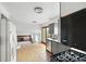 Kitchen and dining area featuring stainless steel appliances, and wood floors at 2527 S Ouray Way, Aurora, CO 80013