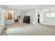 Bright living room featuring an open floor plan, piano, and natural light at 2527 S Ouray Way, Aurora, CO 80013