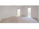 Spacious bedroom featuring neutral carpet, trim and paint, and walk-in closet at 203 S Jackson St, Denver, CO 80209