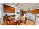 Open concept dining area with glass table, desk area, and hardwood floors at 203 S Jackson St, Denver, CO 80209