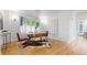 Dining room features a modern table, stylish chairs, and large windows at 203 S Jackson St, Denver, CO 80209