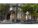 Charming two-story home featuring stone accents and beautiful trees in a residential neighborhood at 203 S Jackson St, Denver, CO 80209