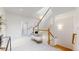 Bright foyer features a staircase, a cozy bench, and natural light at 203 S Jackson St, Denver, CO 80209