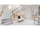 Inviting foyer with staircase, bench seating and natural light from skylight above at 203 S Jackson St, Denver, CO 80209