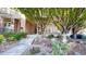 Charming front entrance with stone accents and a beautifully landscaped yard at 203 S Jackson St, Denver, CO 80209