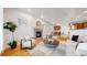 Inviting living room with hardwood floors, fireplace, and open concept design at 203 S Jackson St, Denver, CO 80209