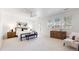 Bright main bedroom with ample natural light, showcasing a seating area and elegant furnishings at 203 S Jackson St, Denver, CO 80209