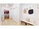 Functional mudroom with built-in bench, storage, and convenient coat hooks at 203 S Jackson St, Denver, CO 80209