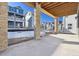 Covered patio with stone pillars and views of neighboring homes at 8570 Eagle River St, Littleton, CO 80125