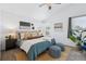 Main bedroom with a king-size bed and sitting area at 2182 S Zeno St, Aurora, CO 80013