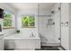 Bathroom with soaking tub and frameless glass shower at 10284 Royal Eagle St, Highlands Ranch, CO 80129