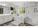 Bathroom featuring double vanity, soaking tub, and a frameless glass shower at 10284 Royal Eagle St, Highlands Ranch, CO 80129