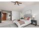 Spacious bedroom with private bath entrance, carpet flooring, and ceiling fan at 10284 Royal Eagle St, Highlands Ranch, CO 80129