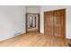 This light-filled bedroom offers hardwood floors and convenient access to a full ensuite bathroom at 10284 Royal Eagle St, Highlands Ranch, CO 80129