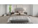 Well-lit bedroom with a luxurious bed, soft carpet, and cozy decor at 10284 Royal Eagle St, Highlands Ranch, CO 80129