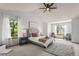 Bright bedroom with vaulted ceiling, ceiling fan, and lots of natural light at 10284 Royal Eagle St, Highlands Ranch, CO 80129