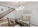 Cozy dining room area with stylish lighting and a view of the staircase at 10284 Royal Eagle St, Highlands Ranch, CO 80129