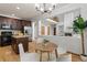 Kitchen island, stainless steel refrigerator, and breakfast nook at 10284 Royal Eagle St, Highlands Ranch, CO 80129