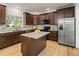 Well-lit kitchen with stainless steel appliances, granite counters, and a functional center island at 10284 Royal Eagle St, Highlands Ranch, CO 80129