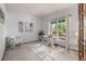 Home office with neutral walls, comfortable seating and desk, and natural light from the outside at 10284 Royal Eagle St, Highlands Ranch, CO 80129