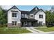 Charming modern two-story home featuring a landscaped yard, and a delightful covered entry at 15218 Detroit St, Thornton, CO 80602
