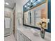 Updated bathroom with a vanity, mirror, and shower at 2665 S Sheridan Ct, Lakewood, CO 80227