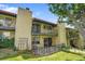 Charming brick condo with two balconies, ground floor patio and lush green lawn at 2665 S Sheridan Ct, Lakewood, CO 80227